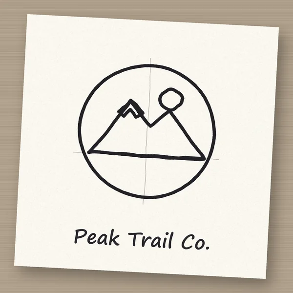 Before: a hand-drawn mountain logo sketch on paper with pencil guides