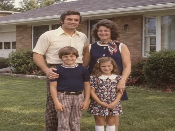Faded family photo restored with sharper faces and fresher colors
