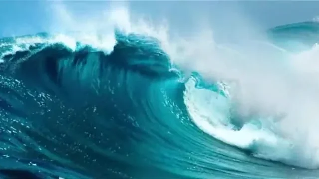 AI video frame of a turquoise ocean wave curling in slow motion, camera at water level