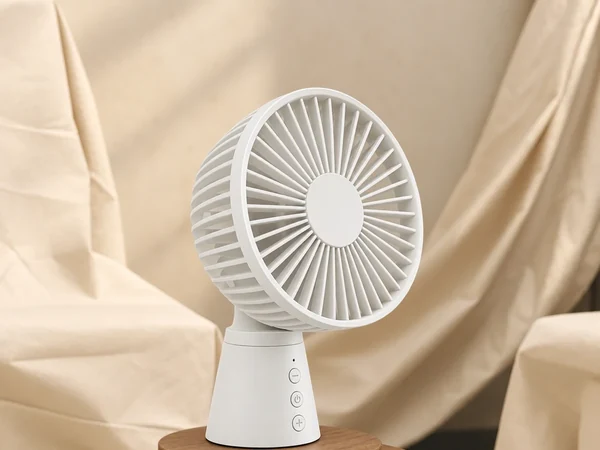 White desk fan on a wooden stand in front of draped cream fabric, a neutral product photo idea