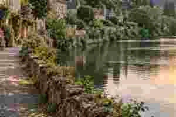 Simulated macroblocking: square compression blocks across trees, a path and water
