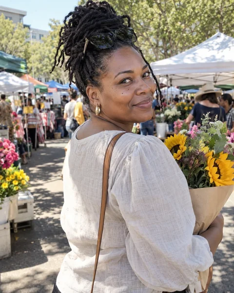 Candid dating photo of a woman holding flowers at a weekend market