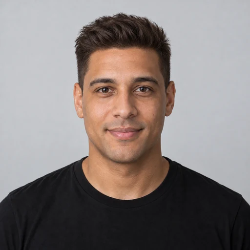 Man with a textured quiff that adds height above a round face