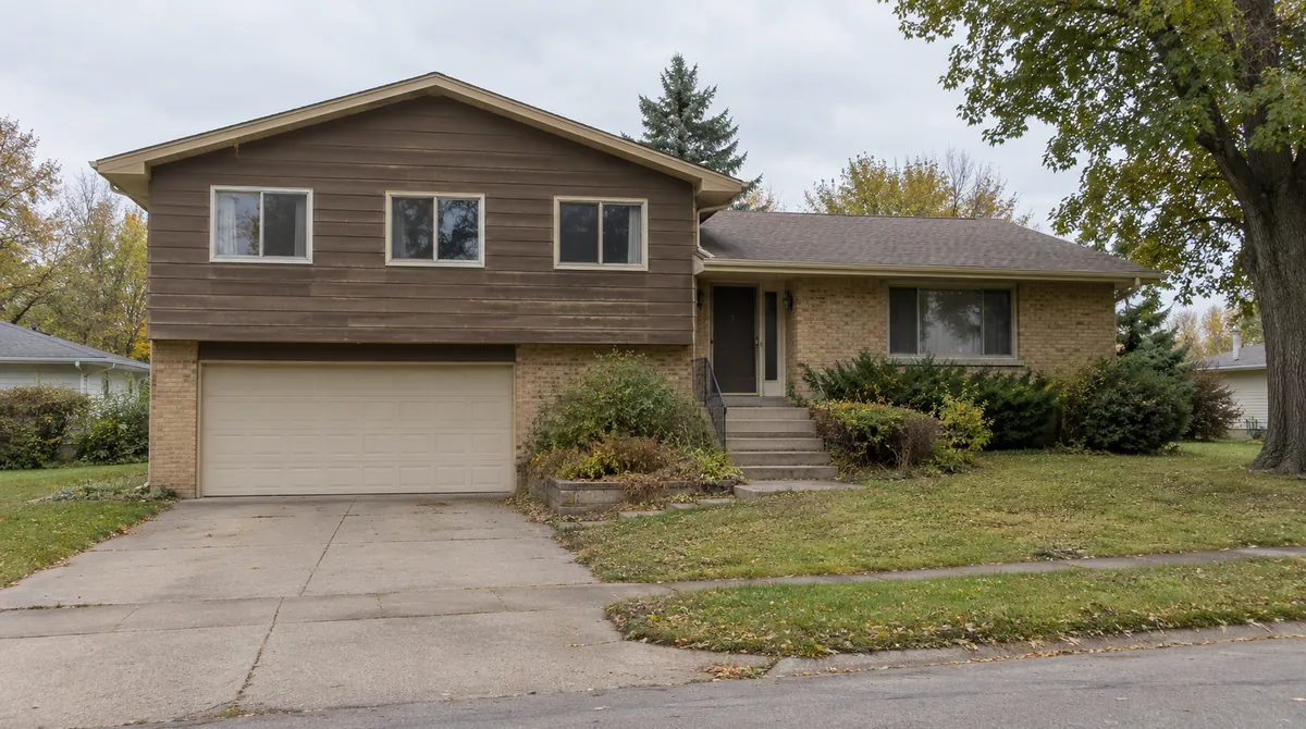Drag to compare the 1970s split-level and its contemporary remodel (before)
