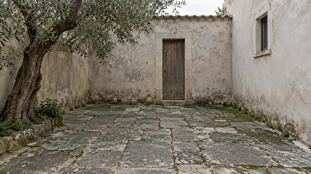 Drag to compare the plain courtyard and the bohemian courtyard design (before)