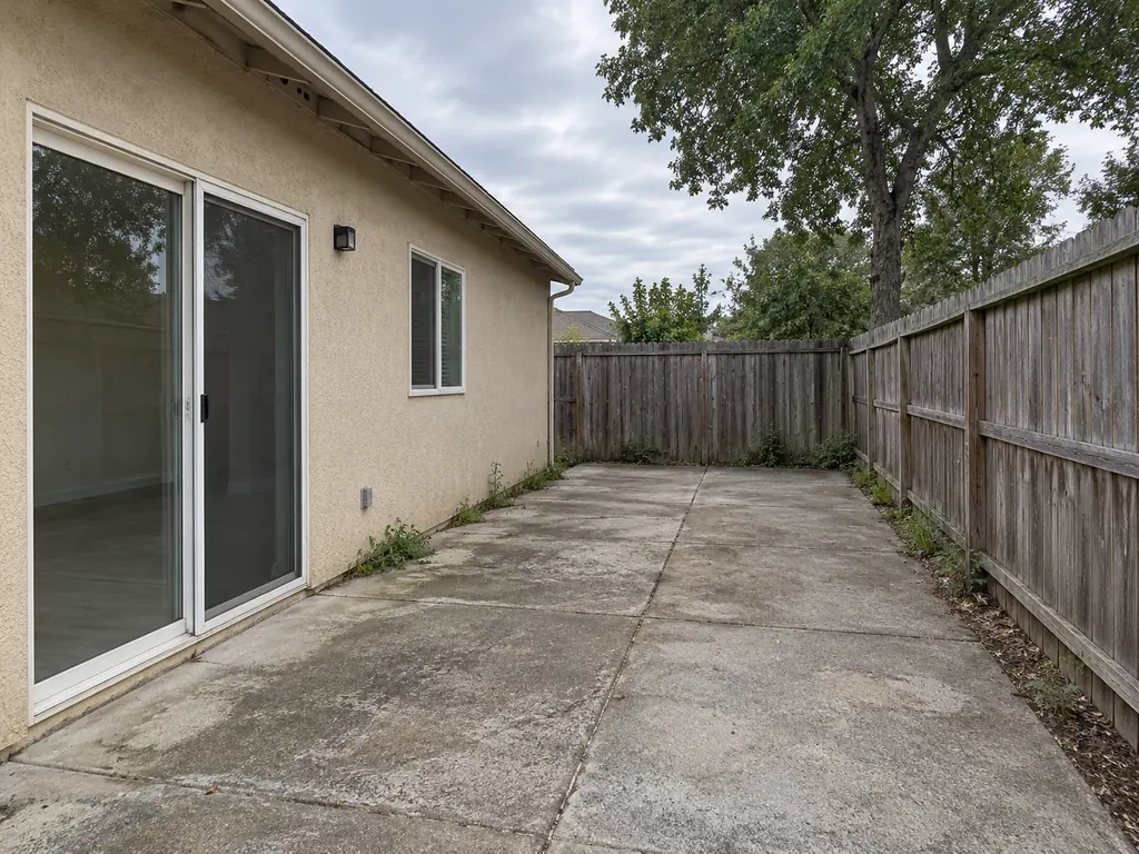 Drag to compare a bare side yard and the same space as a Mediterranean terrace (before)