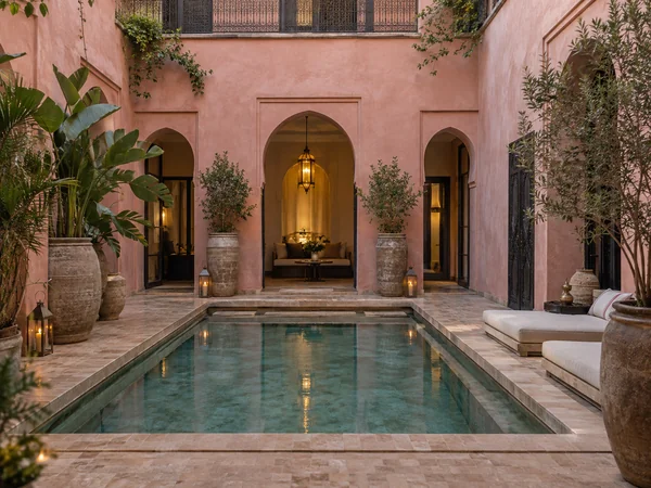 Moroccan-style courtyard with a plunge pool and pink walls