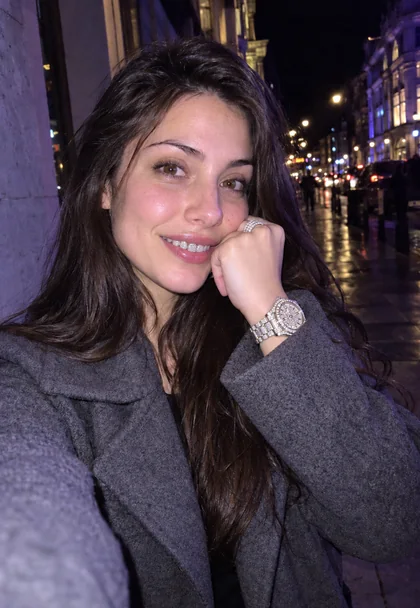 Drag to compare a street selfie with the same woman wearing diamond grillz and an iced-out watch (after)