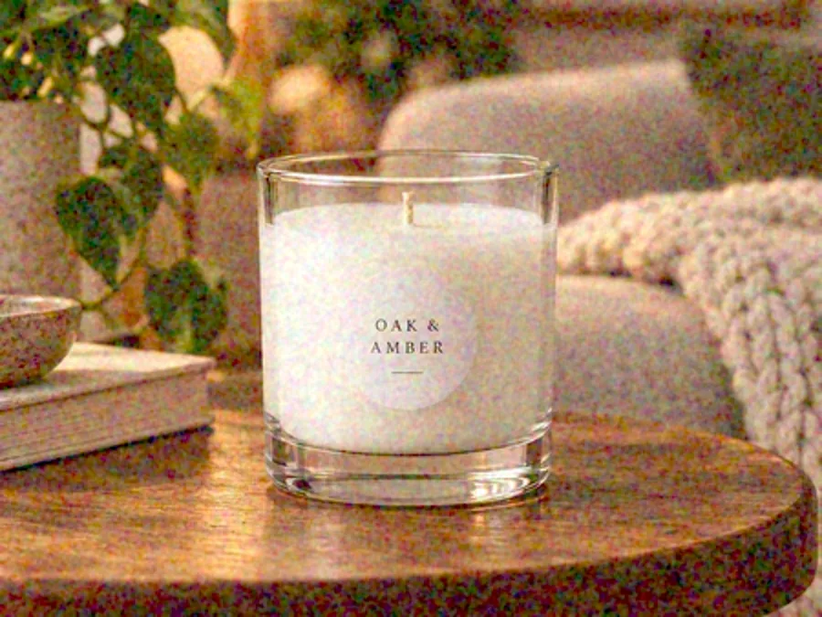 Drag to compare the small, grainy product photo of a candle and the clean 2× larger version (before)