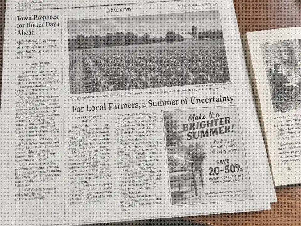 Drag to compare the newspaper page before and after halftone removal (before)