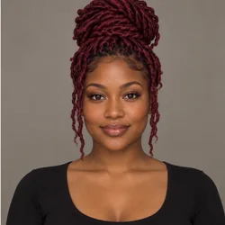 Woman with deep burgundy locs pulled up at the crown