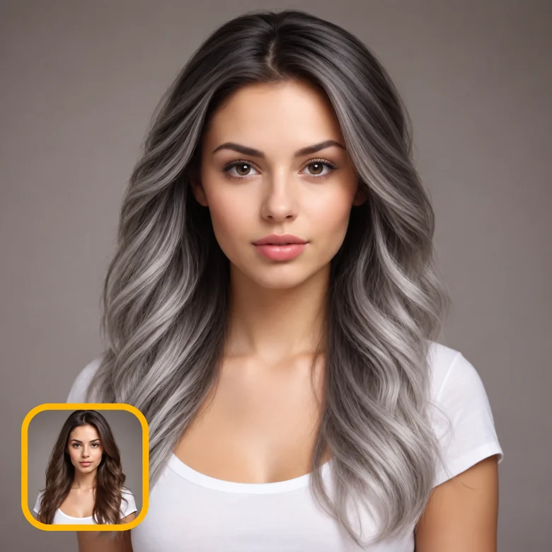 A woman with long grey balayage hair, with an inset of her original brown hair