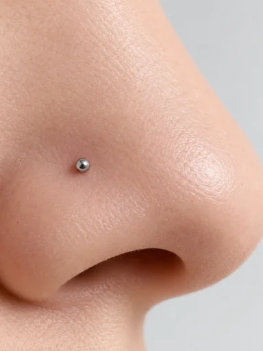 Close-up of a tiny stud placed high on the nostril