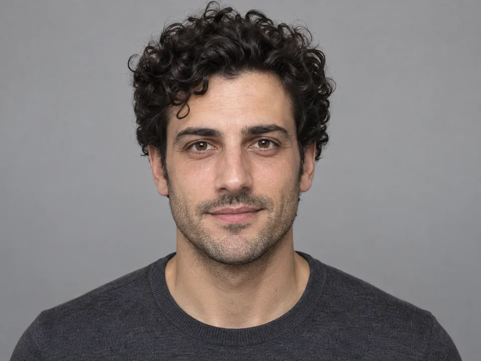 Drag to compare the curly-haired man with dark under-eye circles and the rested, retouched portrait (after)