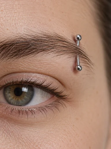 Close-up of a silver eyebrow ring