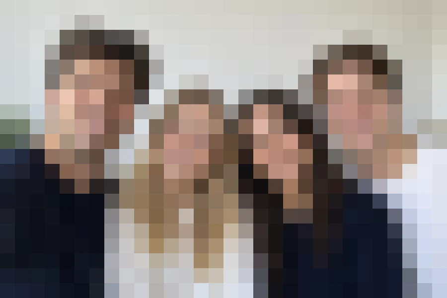 Drag to compare the group selfie and the heavily pixelated version (after)