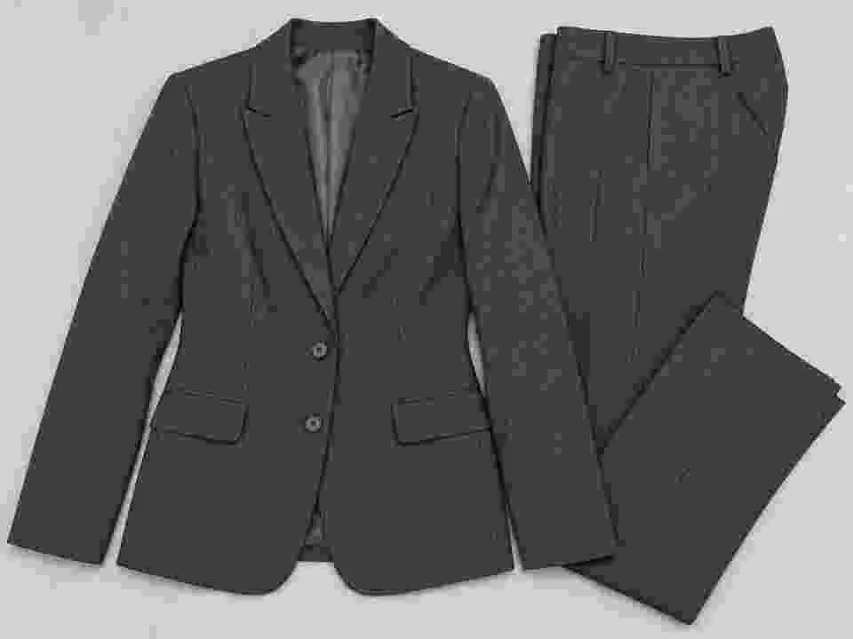 Drag to compare the compressed suit photo and the restored fabric detail (before)
