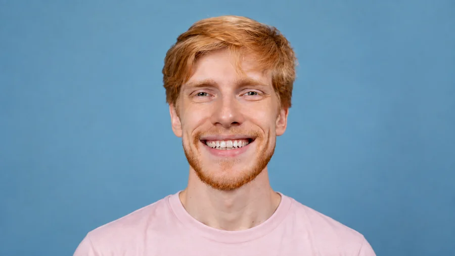 Drag to compare a studio portrait before and after adjusting whitening strength (after)