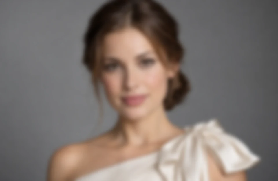 Drag to compare the soft portrait and the 4K unblurred portrait with sharp eyes and hair (before)