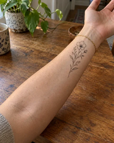 A fine-line tattoo tried on the wrist with AI