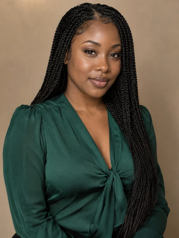 Woman wearing a long knotless box braid wig